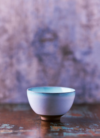 Traditional japanese ceramic on rustic wooden background. Soft focus. Copy space.の写真素材