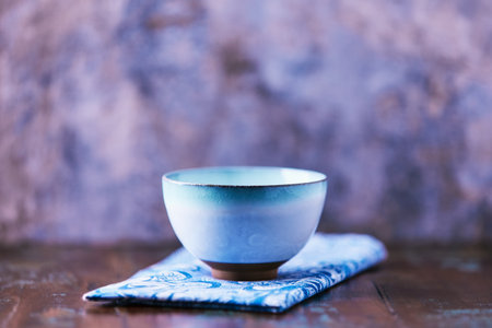 Traditional japanese ceramic on rustic wooden background. Soft focus. Copy space.の写真素材