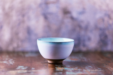 Traditional japanese ceramic on rustic wooden background. Soft focus. Copy space.の写真素材