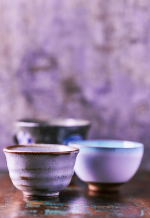 Traditional japanese ceramic on rustic wooden background. Soft focus. Copy space.の写真素材