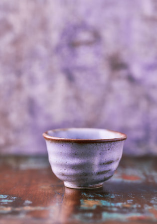 Traditional japanese ceramic on rustic wooden background. Soft focus. Copy space.の写真素材