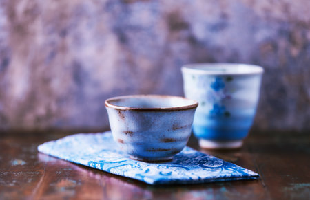 Traditional japanese ceramic on rustic wooden background. Soft focus. Copy space.の写真素材
