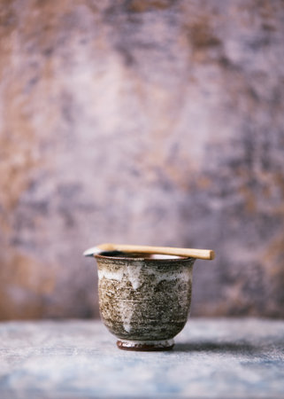 Traditional japanese ceramic on rustic wooden background. Soft focus. Copy space.の写真素材
