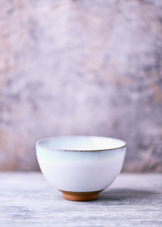 Traditional japanese ceramic on rustic wooden background. Soft focus. Copy space.の写真素材