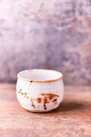 Traditional japanese ceramic on rustic wooden background. Soft focus. Copy space.の写真素材