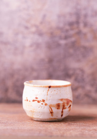 Traditional japanese ceramic on rustic wooden background. Soft focus. Copy space.の写真素材
