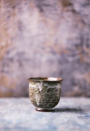Traditional japanese ceramic on rustic wooden background. Soft focus. Copy space.の写真素材