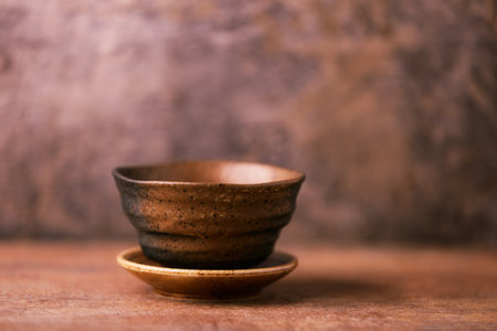 Traditional japanese ceramic on rustic wooden background. Soft focus. Copy space.の写真素材