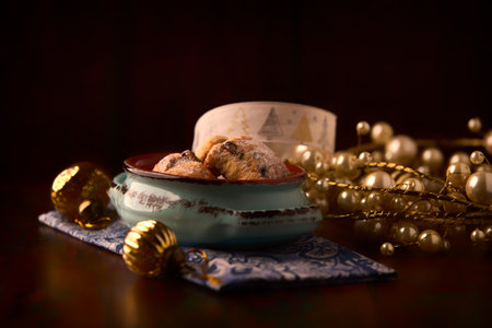 Christmas still life with cookies in a ceramic bowl on a dark backgroundの写真素材