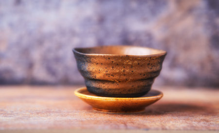 Traditional japanese ceramic on rustic wooden background. Soft focus. Copy space.