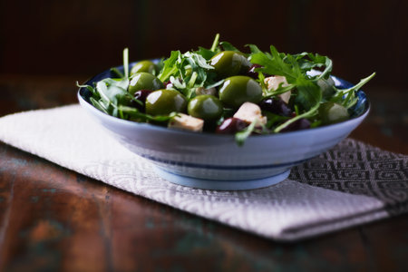 Green olives salad with feta cheese and arugula leavesの写真素材