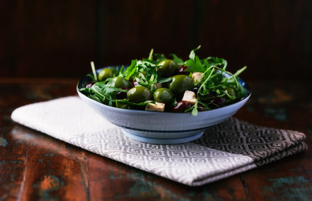 Green salad with olives, arugula and feta cheeseの写真素材