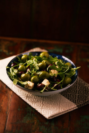 Green olives salad with arugula leavesの写真素材