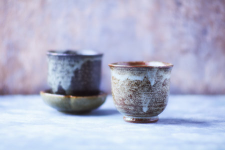 Two cups on a wooden background. Selective focus.の写真素材