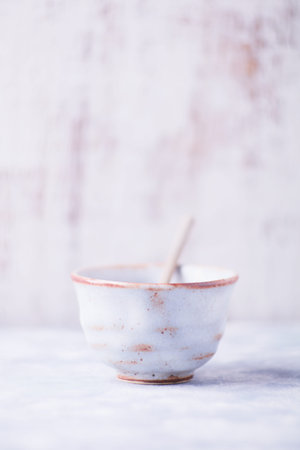 Traditional japanese ceramic on rustic wooden background. Soft focus. Copy space.