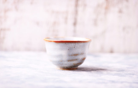 Ceramic tea cup on a light background. Selective focus.の写真素材
