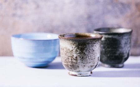 Traditional japanese ceramic on rustic wooden background. Soft focus. Copy space.の写真素材