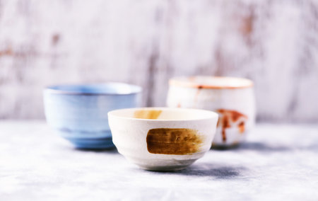 Ceramic bowls for tea or coffee. Selective focus.