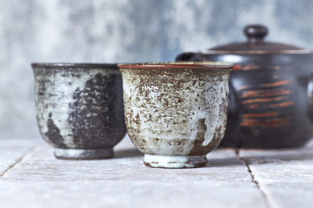 Ceramic tableware on rustic wooden background, copy space