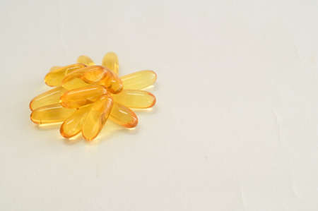 Pile of capsules Omega 3 on white backgroundの写真素材