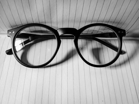 Black and white spectacle on the open diary note book