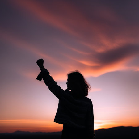 woman in red dress with a backpack on the mountain sunsetの素材