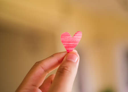 Hand holding a Drawn Heartの写真素材