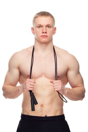 one caucasian man exercising jumping rope in silhouette studio  on white background.の写真素材
