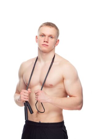 Beautiful muscular man with a ropeの写真素材