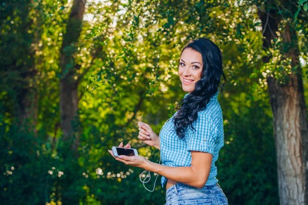 young hipster stylish beautiful girl listening to musicの写真素材