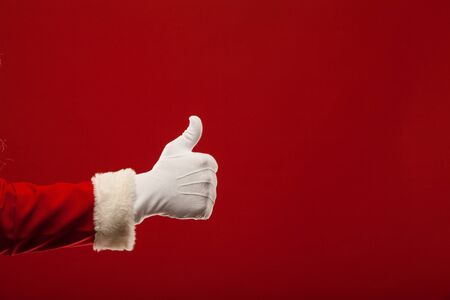 Photo of Santa Claus gloved hand in good gestureの写真素材