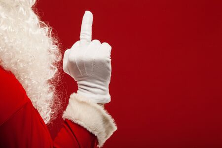 Photo of Santa Claus gloved hand in pointing gestureの写真素材