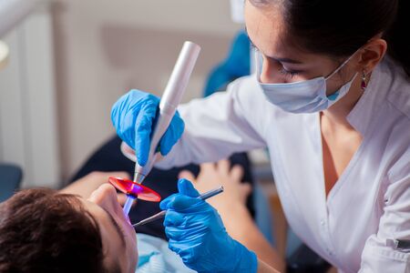 Man having teeth examined at dentists. dental treatmentの写真素材