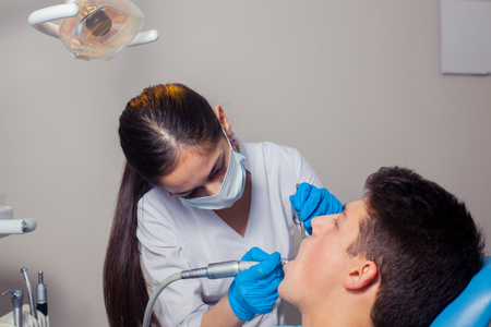 Man having teeth examined at dentists. dental treatmentの写真素材