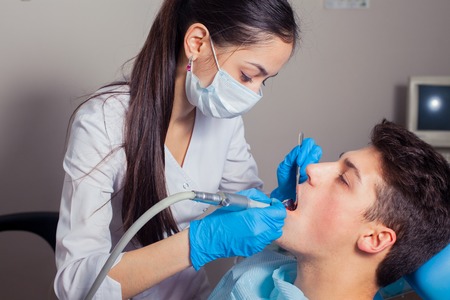 Man having teeth examined at dentists. dental treatmentの写真素材