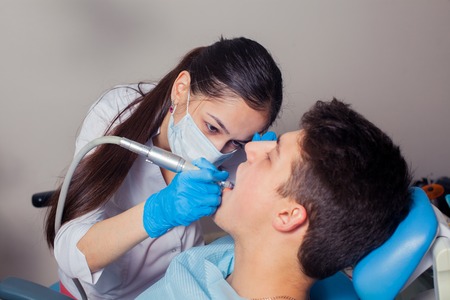 Man having teeth examined at dentists. dental treatmentの写真素材