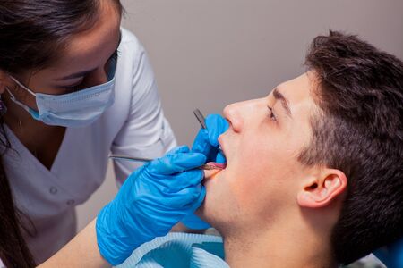 Man having teeth examined at dentists. dental treatmentの写真素材