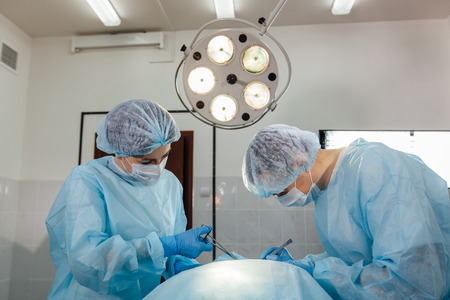 Surgeons team working with Monitoring of patient in surgical operating roomの写真素材