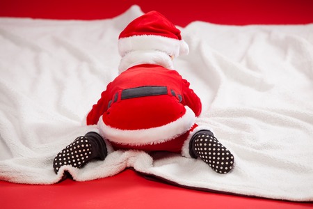 Merry christmas baby santa claus back view.の写真素材