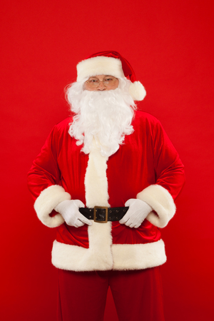 Photo of happy Santa Claus in eyeglasses looking at camera. Merry Christmasの写真素材