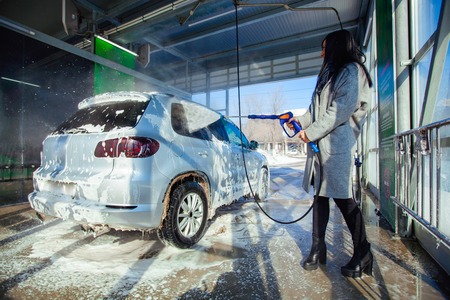 Manual car wash with pressurized water in car wash outsideの写真素材