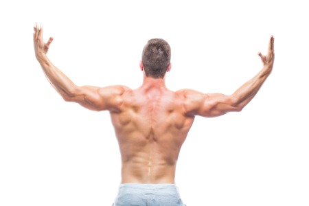 Powerful back. Strong Athletic Man - Fitness Model showing his perfect body isolated on white...