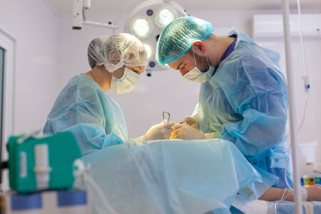 Hospital. Surgeon operates in the operating room. Surgeons save life to the injured