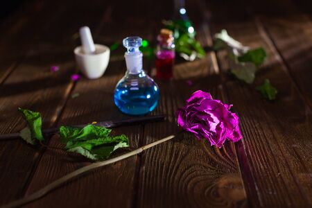 Witchcraft. Witch doctor desk table. Magic potion. ALternative medicine concept. Divination, love potion. Mysterious clouds of smoke.の写真素材