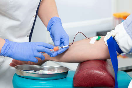 Close up of the process of taking blood samples from a patient in a modern medical laboratory....