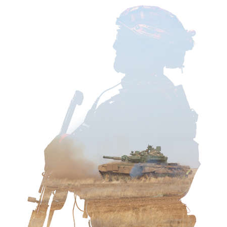 A soldier in camouflage in knee gear in a helmet with a machine gun against the background of a...