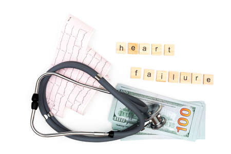 Heart failure. Flatlay arrangement. Stethoscope with electrocardiogram sheet and US dollars on isolated white background. Place to copy paste.の写真素材