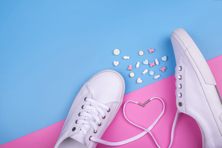 Fashion Trendy White Sneakers with Heart. Pastel Pink Blue Color. Jellies candies sharks. Valentines day concept. Woman Set. Minimal Style. Summer Floral Sneakers. Flat lay. Art Design. Love, Valentines day conceptの写真素材