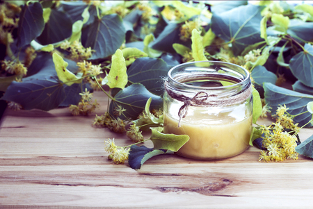 Linden flowers and Honey on a wooden backgroundの写真素材