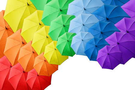 Rainbow umbrella isolated on white background. Blue, green, pink, yellow colors collageの写真素材